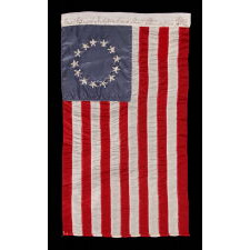 13 HAND-EMBROIDERED STARS AND EXPERTLY HAND-SEWN STRIPES ON AN ANTIQUE AMERICAN FLAG MADE IN PHILADELPHIA BY SARAH M. WILSON, GREAT-GRANDDAUGHTER OF BETSY ROSS, SIGNED & DATED 1911