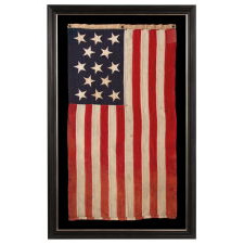 13 HAND-SEWN STARS IN A 3-2-3-2-3 PATTERN ON AN ANTIQUE AMERICAN FLAG, A U.S. NAVY SMALL BOAT ENSIGN MADE AT MARE ISLAND, CALIFORNIA, HEADQUARTERS OF THE PACIFIC FLEET, SIGNED & DATED 1902