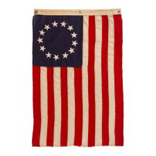 13 STARS IN THE BETSY ROSS PATTERN ON A SMALL-SCALE ANTIQUE AMERICAN FLAG MADE SOMETIME BETWEEN APPROXIMATELY 1910 AND THE 1926 SESQUICENTENNIAL OF AMERICAN INDEPENDENCE