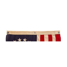 13 STARS IN THE BETSY ROSS PATTERN ON A SMALL-SCALE ANTIQUE AMERICAN FLAG MADE SOMETIME BETWEEN APPROXIMATELY 1910 AND THE 1926 SESQUICENTENNIAL OF AMERICAN INDEPENDENCE