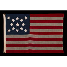 13 STARS IN A MEDALLION CONFIGURATION, ON A SMALL-SCALE ANTIQUE AMERICA FLAG MADE DURING THE LAST DECADE OF THE 19th CENTURY