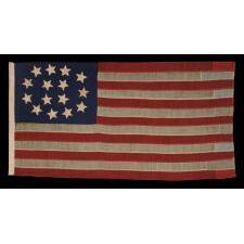 15 STARS IN AN EXTRAORDINARY ARRANGEMENT THAT CONSISTS OF AN OVAL WREATH OF 11, SURROUNDING A SQUARE OF 4; A UNIQUE & ENTIRELY HAND-SEWN, ANTIQUE AMERICAN FLAG MADE WITH SOUTHERN SYMPATHIES, REMOVING THE FREE STATES FROM THE STAR COUNT, LIKELY circa 1861: