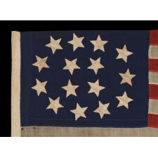 15 STARS IN AN EXTRAORDINARY ARRANGEMENT THAT CONSISTS OF AN OVAL WREATH OF 11, SURROUNDING A SQUARE OF 4; A UNIQUE & ENTIRELY HAND-SEWN, ANTIQUE AMERICAN FLAG MADE WITH SOUTHERN SYMPATHIES, REMOVING THE FREE STATES FROM THE STAR COUNT, LIKELY circa 1861:
