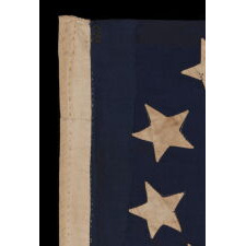 15 STARS IN AN EXTRAORDINARY ARRANGEMENT THAT CONSISTS OF AN OVAL WREATH OF 11, SURROUNDING A SQUARE OF 4; A UNIQUE & ENTIRELY HAND-SEWN, ANTIQUE AMERICAN FLAG MADE WITH SOUTHERN SYMPATHIES, REMOVING THE FREE STATES FROM THE STAR COUNT, LIKELY circa 1861: