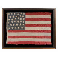 33 HAPHAZARDLY PLACED STARS AND 11 STRIPES ON AN ANTIQUE AMERICAN FLAG WITH ITS CANTON RESTING ON THE WAR STRIPE, POSSIBLY MADE WITH SOUTHERN SYMPATHIES; REFLECTS THE ADDITION OF OREGON TO THE UNION ON VALENTINE’S DAY, 1859; OFFICIAL FROM JULY 4th OF THAT YEAR - JULY 3rd, 1861