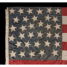 33 HAPHAZARDLY PLACED STARS AND 11 STRIPES ON AN ANTIQUE AMERICAN FLAG WITH ITS CANTON RESTING ON THE WAR STRIPE, POSSIBLY MADE WITH SOUTHERN SYMPATHIES; REFLECTS THE ADDITION OF OREGON TO THE UNION ON VALENTINE’S DAY, 1859; OFFICIAL FROM JULY 4th OF THAT YEAR - JULY 3rd, 1861