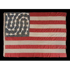 33 HAPHAZARDLY PLACED STARS AND 11 STRIPES ON AN ANTIQUE AMERICAN FLAG WITH ITS CANTON RESTING ON THE WAR STRIPE, POSSIBLY MADE WITH SOUTHERN SYMPATHIES; REFLECTS THE ADDITION OF OREGON TO THE UNION ON VALENTINE’S DAY, 1859; OFFICIAL FROM JULY 4th OF THAT YEAR - JULY 3rd, 1861
