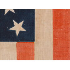 33 STARS IN A MEDALLION CONFIGURATION ON A LARGE SCALE ANTIQUE AMERICAN PARADE FLAG, AN EXTREMELY RARE EXAMPLE, OREGON STATEHOOD, 1859-1861