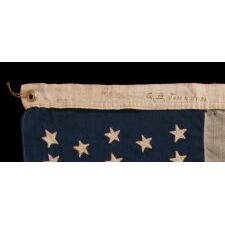 38 HAND-SEWN STARS ON AN ANTIQUE AMERICAN FLAG IN AN EXTRAORDINARILY TINY SCALE AMONG ITS PIECED-AND-SEWN COUNTERPARTS, MADE AT THE TIME WHEN COLORADO WAS THE MOST RECENT STATE TO JOIN THE UNION, 1876-1889; PROBABLY MADE BY THE ANNIN COMPANY IN NEW YORK CITY, SIGNED BY MEMBERS OF THE GRIMES & JOHNSON FAMILIES OF CANANDAIGUA, NEW YORK