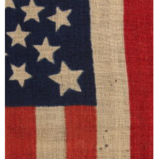 38 STARS, COLORADO STATEHOOD, A SCARCE AND BEAUTIFUL ANTIQUE AMERICAN FLAG WITH A MEDALLION PATTERN AND 4 LARGE CORNER STARS, PRESS-DYED ON WOOL BUNTING, MADE BY HORSTMANN BROTHERS IN PHILADELPHIA FOR THE 1876 CENTENNIAL OF OUR NATION’S INDEPENDENCE
