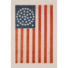 38 STARS IN A MEDALLION CONFIGURATION WITH 2 OUTLIERS, ON AN ANTIQUE AMERICAN FLAG WITH VIBRANT COLORATION, REFLECTS THE PERIOD WHEN COLORADO WAS THE MOST RECENT STATE TO JOIN THE UNION, circa 1876-1889; FORMERLY IN THE COLLECTION OF RICHARD PIERCE, ILLUSTRATED IN HIS BOOK: “THE STARS & STRIPES: FABRIC OF THE AMERICAN SPIRIT” (2005)