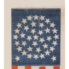 38 STARS IN A MEDALLION CONFIGURATION WITH 2 OUTLIERS, ON AN ANTIQUE AMERICAN FLAG WITH VIBRANT COLORATION, REFLECTS THE PERIOD WHEN COLORADO WAS THE MOST RECENT STATE TO JOIN THE UNION, circa 1876-1889; FORMERLY IN THE COLLECTION OF RICHARD PIERCE, ILLUSTRATED IN HIS BOOK: “THE STARS & STRIPES: FABRIC OF THE AMERICAN SPIRIT” (2005)