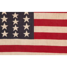 39 STARS IN TWO SIZES, ALTERNATING FROM ONE COLUMN TO THE NEXT, ON AN ANTIQUE AMERICAN PARADE FLAG WITH AN UNUSUALLY ELONGATED PROFILE, DATING TO THE 1876 CENTENNIAL, NEVER AN OFFICIAL STAR COUNT, REFLECTS THE ANTICIPATED ARRIVAL OF COLORADO AND THE DAKOTA
