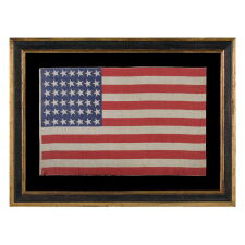 42 CANTED STARS ON AN ANTIQUE AMERICAN FLAG THAT REFLECTS THE ADDITION OF WASHINGTON STATE, MONTANA, AND THE DAKOTAS, NEVER AN OFFICIAL STAR COUNT, circa 1889-1890