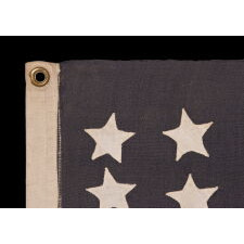 42 HAND-SEWN STARS ON AN ANTIQUE AMERICAN FLAG WITH A TWO-TONE, DUSTY BLUE CANTON, REFLECTS THE ADDITION OF WASHINGTON STATE, MONTANA, AND THE DAKOTAS, NEVER AN OFFICIAL STAR COUNT, circa 1889-1890