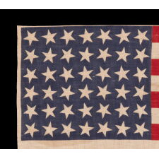 42 STARS ON AN ANTIQUE AMERICAN FLAG WITH SCATTERED STAR POSITIONING, REFLECTS THE ADDITION OF WASHINGTON STATE, MONTANA, AND THE DAKOTAS, NEVER AN OFFICIAL STAR COUNT, circa 1889-1890