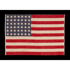 42 STARS ON AN ANTIQUE AMERICAN FLAG WITH SCATTERED STAR POSITIONING, REFLECTS THE ADDITION OF WASHINGTON STATE, MONTANA, AND THE DAKOTAS, NEVER AN OFFICIAL STAR COUNT, circa 1889-1890