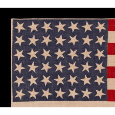 42 STARS ON AN ANTIQUE AMERICAN FLAG WITH SCATTERED STAR POSITIONING, REFLECTS THE ADDITION OF WASHINGTON STATE, MONTANA, AND THE DAKOTAS, NEVER AN OFFICIAL STAR COUNT, circa 1889-1890