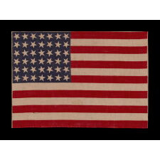 42 STARS ON AN ANTIQUE AMERICAN FLAG WITH SCATTERED STAR POSITIONING, REFLECTS THE ADDITION OF WASHINGTON STATE, MONTANA, AND THE DAKOTAS, NEVER AN OFFICIAL STAR COUNT, circa 1889-1890