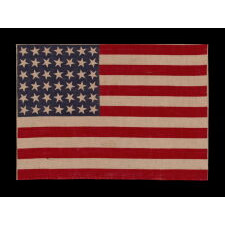 42 STARS ON AN ANTIQUE AMERICAN FLAG WITH SCATTERED STAR POSITIONING, REFLECTS THE ADDITION OF WASHINGTON STATE, MONTANA, AND THE DAKOTAS, NEVER AN OFFICIAL STAR COUNT, circa 1889-1890