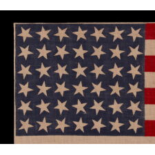42 STARS ON AN ANTIQUE AMERICAN FLAG WITH SCATTERED STAR POSITIONING, REFLECTS THE ADDITION OF WASHINGTON STATE, MONTANA, AND THE DAKOTAS, NEVER AN OFFICIAL STAR COUNT, circa 1889-1890