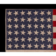 42 STARS ON AN ANTIQUE AMERICAN FLAG WITH SCATTERED STAR POSITIONING, REFLECTS THE ADDITION OF WASHINGTON STATE, MONTANA, AND THE DAKOTAS, NEVER AN OFFICIAL STAR COUNT, circa 1889-1890