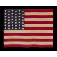 42 STARS ON AN ANTIQUE AMERICAN FLAG WITH A WAVE CONFIGURATION OF LINEAL COLUMNS, AN UNOFFICIAL STAR COUNT THAT REFLECTS THE ADDITION OF WASHINGTON STATE, MONTANA, AND THE DAKOTAS, circa 1889-1890