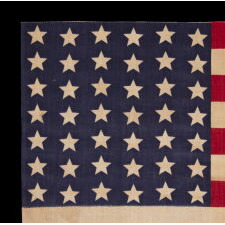 42 STARS ON AN ANTIQUE AMERICAN FLAG WITH A WAVE CONFIGURATION OF LINEAL COLUMNS, AN UNOFFICIAL STAR COUNT THAT REFLECTS THE ADDITION OF WASHINGTON STATE, MONTANA, AND THE DAKOTAS, circa 1889-1890