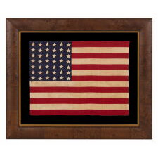 42 STARS ON AN ANTIQUE AMERICAN FLAG WITH A WAVE CONFIGURATION OF LINEAL COLUMNS, AN UNOFFICIAL STAR COUNT THAT REFLECTS THE ADDITION OF WASHINGTON STATE, MONTANA, AND THE DAKOTAS, circa 1889-1890