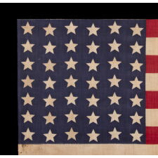 42 STARS ON AN ANTIQUE AMERICAN FLAG WITH A WAVE CONFIGURATION OF LINEAL COLUMNS, AN UNOFFICIAL STAR COUNT THAT REFLECTS THE ADDITION OF WASHINGTON STATE, MONTANA, AND THE DAKOTAS, circa 1889-1890