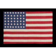 44 STARS IN JUSTIFIED ROWS, WITH VARIED STAR POSITIONING, ON A SILK, ANTIQUE AMERICAN FLAG WITH STRIKING COLORS, REFLECTS WYOMING STATEHOOD, circa 1890-1896