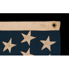 44 STARS IN ZIGZAGGING, STAGGERED ROWS, ON ANTIQUE AMERICAN FLAG WITH SOMEWHAT ELONGATED PROPORTIONS AND STRONG COLORS, MADE IN THE ERA WHEN WYOMING WAS THE MOST RECENT STATE TO JOIN THE UNION, 1890-1896