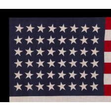 48 STARS CANTED TO THE RIGHT AND LEFT IN DANCING ROWS, A RARE VARIETY OF ANTIQUE AMERICAN PARADE FLAG IN A LARGE SCALE, 1912-1918 OR PERHAPS EARLIER, REFLECTS ARIZONA & NEW MEXICO STATEHOOD