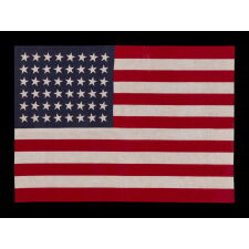 48 STARS CANTED TO THE RIGHT AND LEFT IN DANCING ROWS, A RARE VARIETY OF ANTIQUE AMERICAN PARADE FLAG IN A LARGE SCALE, 1912-1918 OR PERHAPS EARLIER, REFLECTS ARIZONA & NEW MEXICO STATEHOOD