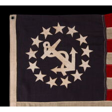 ANTIQUE AMERICAN PRIVATE YACHT FLAG / ENSIGN WITH 13 STARS AND A CANTED ANCHOR, circa 1895 – 1940
