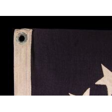 ANTIQUE AMERICAN PRIVATE YACHT FLAG / ENSIGN WITH 13 STARS AND A CANTED ANCHOR, circa 1895 – 1940