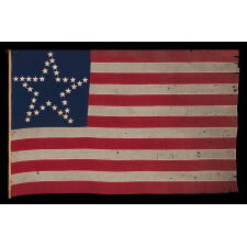 CIVIL WAR PERIOD ANTIQUE AMERICAN FLAG WITH 35 STARS IN A “GREAT STAR” OR “GREAT LUMINARY” PATTERN, A VERY RARE VARIETY WITH AN OPEN, LONE STAR PROFILE, LACKING STARS INSIDE OR BEYOND THE ARRANGEMENT; MADE circa 1863-65, REFLECTS THE ADMISSION OF WEST VIRGINIA TO THE UNION AS A FREE STATE, ANNEXED FROM VIRGINIA JUST 10 DAYS BEFORE THE BATTLE OF GETTYSBURG; PROBABLY WAR-CARRIED