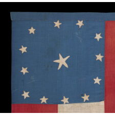 CIVIL WAR PERIOD CONFEDERATE FLAG IN THE FIRST NATIONAL PATTERN (a.k.a., STARS & BARS), HOMEMADE & ENTIRELY HAND-SEWN, WITH 13 STARS ARRANGED IN A WIDELY DISPURSED WREAT OF 12, WITH A LARGE, STARFISH-SHAPED CENTER STAR, ON A CANTON OF BLUE COTTON CHINTZ, DEC. 1861 – JUNE 1863