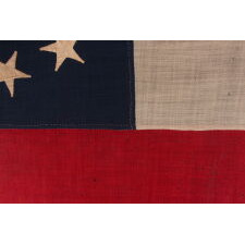 CONFEDERATE 1st NATIONAL PATTERN COMPANY FLAG (A.K.A., "STARS & BARS"), CARRIED BY THE “GRIMES COUNTY GREYS,” FORMALLY DESIGNATED “G” COMPANY OF THE 4th TEXAS INFANTRY, INTEGRAL TO HOOD’S FAMOUS “TEXAS BRIGADE,” ARMY OF NORTHERN VIRGINIA; ATTRIBUTED TO FLAG MAKER HENRY CASSIDY OF NEW ORLEANS; SENT TO THE FAMILY OF SGT. JAMES L. GOULD IN 1863, FOLLOWING HIS DEATH AT LITTLE ROUND TOP, GETTYSBURG