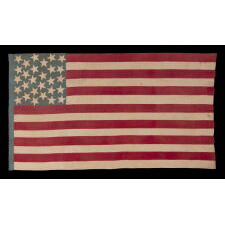 28 STAR, HOMEMADE, ANTIQUE AMERICAN FLAG WITH A CORNFLOWER BLUE CANTON RESTING ON THE “BLOOD” STRIPE; REFLECTS THE ADDITION OF TEXAS ON DEC. 29th, 1845; MEXICAN-WAR ERA; ONE OF THE RAREST STAR COUNTS OF THE 19th CENTURY, OFFICIAL FOR JUST ONE YEAR (1846-47); THE COMPLEMENT OF 14 STRIPES DISPLAYS NATIONAL DISUNION, REFLECTING ALL OF THE SLAVE-HOLDING STATES SAVE DELAWARE, WHERE THE INSTITUTION HAD BEEN DWINDLING FOR DECADES & POLITICIANS COULD NOT BE TRUSTED TO VOTE WITH A UNIFIED BLOC