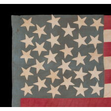28 STAR, HOMEMADE, ANTIQUE AMERICAN FLAG WITH A CORNFLOWER BLUE CANTON RESTING ON THE “BLOOD” STRIPE; REFLECTS THE ADDITION OF TEXAS ON DEC. 29th, 1845; MEXICAN-WAR ERA; ONE OF THE RAREST STAR COUNTS OF THE 19th CENTURY, OFFICIAL FOR JUST ONE YEAR (1846-47); THE COMPLEMENT OF 14 STRIPES DISPLAYS NATIONAL DISUNION, REFLECTING ALL OF THE SLAVE-HOLDING STATES SAVE DELAWARE, WHERE THE INSTITUTION HAD BEEN DWINDLING FOR DECADES & POLITICIANS COULD NOT BE TRUSTED TO VOTE WITH A UNIFIED BLOC