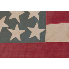 28 STAR, HOMEMADE, ANTIQUE AMERICAN FLAG WITH A CORNFLOWER BLUE CANTON RESTING ON THE “BLOOD” STRIPE; REFLECTS THE ADDITION OF TEXAS ON DEC. 29th, 1845; MEXICAN-WAR ERA; ONE OF THE RAREST STAR COUNTS OF THE 19th CENTURY, OFFICIAL FOR JUST ONE YEAR (1846-47); THE COMPLEMENT OF 14 STRIPES DISPLAYS NATIONAL DISUNION, REFLECTING ALL OF THE SLAVE-HOLDING STATES SAVE DELAWARE, WHERE THE INSTITUTION HAD BEEN DWINDLING FOR DECADES & POLITICIANS COULD NOT BE TRUSTED TO VOTE WITH A UNIFIED BLOC