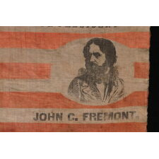 EXTRAORDINARILY RARE, PORTRAIT STYLE PARADE FLAG, MADE FOR THE PRESIDENTIAL CAMPAIGN OF JOHN FRÉMONT, WHO OPENED THE GATEWAY TO CALIFORNIA STATEHOOD, WAS THE REPUBLICAN PARTY’S FIRST PRESIDENTIAL CANDIDATE, AND RAN ON AN ANTI-SLAVERY PLATFORM; DISPLAYING 13 STARS, ARRANGED IN THE TRUMBULL PATTERN