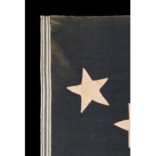 SPECTACULAR ANTIQUE AMERICAN FLAG WITH 38 STARS, ARRANGED IN A RARE VARIANT OF THE "GREAT STAR" PATTERN THAT INCORPORATES STARS BETWEEN EACH ARM; MADE FOR THE 100th ANNIVERSARY OF AMERICAN INDEPENDENCE IN 1876, AMONG THE VERY BEST OF ALL KNOWN EXAMPLES IN THIS STAR COUNT, REFLECTS THE ADDITION OF COLORADO AS THE “CENTENNIAL STATE”