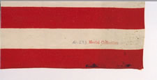 FROM THE MASTAI COLLECTION: A RARE 38 STAR AMERICAN FLAG WITH MULTI-COLOR CIVIL WAR VETERAN'S BADGE AT THE CENTER OF A MEDALLION STAR PATTERN