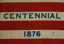 RARE 38 STAR ANTIQUE AMERICAN PARADE FLAG WITH "1876 CENTENNIAL" ADVERTISING & GOLD STARS, MADE FOR THE 1876 CENTENNIAL INTERNATIONAL EXPOSITION IN PHILADELPHIA