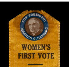 GOLDEN YELLOW SILK RIBBON & PINBACK COMBINATION, DENOTING THE ENDORSEMENT OF THE SUFFRAGE CAUSE BY UNITED STATES SENATOR & REPUBLICAN PRESIDENTIAL NOMINEE WARREN G. HARDING OF OHIO, IN THE MATTER RATIFYING THE 19TH AMENDMENT