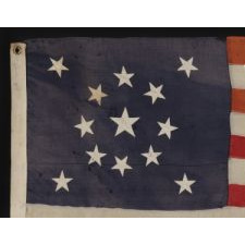 13 STARS ARRANGED IN A MEDALLION PATTERN WITH A LARGE CENTER STAR, ON A SMALL-SCALE FLAG OF THE 1895-1920's ERA