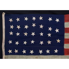 34 STARS IN A HAPHAZZARD LINEAL ARRANGEMENT, ON A CIVIL WAR PERIOD BEARING THE INITIALS OF ANNA PINE DECATUR PARSONS (1812-1896), LIKELY MADE FOR HER BROTHER, COMMODORE STEPHEN DECATUR (1815-1876), PASSED DOWN THROUGH THE DECATUR / STORER FAMILY
