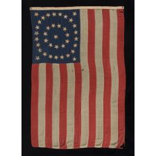 38 STARS IN A MEDALLION CONFIGURATION ON A BEAUTIFUL SCALE FLAG WITH PIECED-AND-SEWN CONSTRUCTION, 1876-1889, COLORADO STATEHOOD
